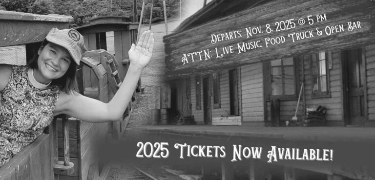 Rev. Jill waving from a toy train with the dates of the event on the train